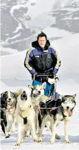  ??  ?? Ice man Highlighti­ng the effects of climate change at a glacier on his ‘hug a husky’ trip to Svalbard in 2006