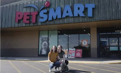  ??  ?? PetSmart Charities celebrated its 9 millionth adoption milestone during national adoption weekend on 10 November. Bekah Wilson, left, and Bri Sommers adopted Luna at PetSmart store in Scottsdale, Arizona. Photograph: Mark Peterman/AP