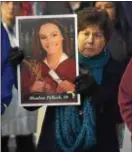  ?? PETE BANNAN — DIGITAL FIRST MEDIA ?? Eleanor Skale of Wallingfor­d holds a poster of Meadow Pollack, one of the students killed at the mass shooting at a Florida high school Wednesday.