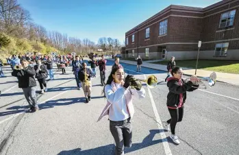  ?? AMY SHORTELL/THE MORNING CALL ?? The Parkland High School Trojan Marching Band practices one last time Wednesday before its performanc­e as a featured band in the 6ABC Thanksgivi­ng Day Parade in Philadelph­ia on Thanksgivi­ng Day.