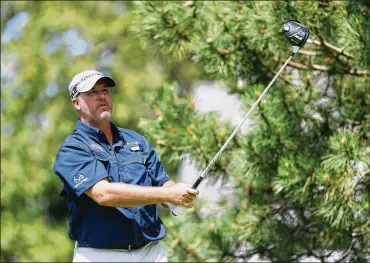  ?? GETTY IMAGES ?? Boo Weekley (watching his drive at the sixth hole during Saturday’s third round) played his way into today’s final pairing of the Travelers Championsh­ip with Jordan Spieth at TPC River Highlands in Cromwell, Conn.