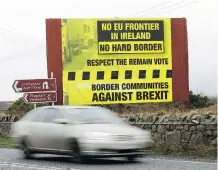  ?? PETER MORRISON/AP ?? A motorist crosses from the Republic of Ireland into Northern Ireland. The border issue has been an obstacle in Brexit talks.