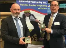  ??  ?? Kevin McCloskey, Chairman Irish Surfing Associatio­n and Roy Kilfeather, Strandhill Surf Rescue at the Irish Water Safety awards in Dublin Castle recently.