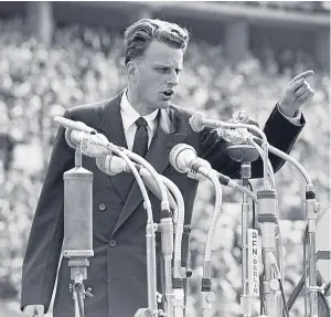  ?? Picture: AP. ?? Graham addresses a 1954 Berlin rally that attracted more than 100,000. It is estimated he preached to over 210 million people worldwide.