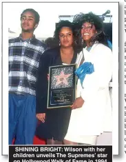  ??  ?? SHINING BRIGHT: Wilson with her children unveils The Supremes’ star on Hollywood Walk of Fame in 1994