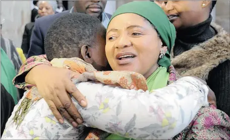  ?? Picture: MATTHEWS BALOYI ?? SAFE: Mpumalanga Social Developmen­t MEC Nomsa Mtsweni embraces one of the two siblings who fell into the hands of trafficker­s on their arrival from Malawi at OR Tambo Airport yesterday.