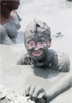  ??  ?? Callum Carroll-Ireton enjoys the “magic mud” of El Totumo.