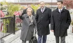  ??  ?? QUEBEC: NDP leader Tom Mulcair, Mayor Colette RoyLaroche, and candidate Jean-Francois Delisle, right, walk through the rebuilt downtown, site of the train fire that killed 47 people two years ago, yesterday in Lac Megantic, Quebec, Canada. Canadians...