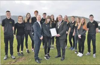  ??  ?? Barry was happy to throw himself into activities and is seen here, left, in full RNLI gear; and above, Provost Ian Clarkson visited Arran High School in February 2018 where he congratula­ted the Active Schools young leaders and head teacher Barry Smith on being finalists in the Provost Civic Pride Awards.