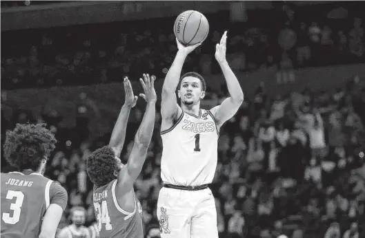  ?? Jamie Squire / Getty Images ?? Jalen Suggs, shooting the game-winning 3-pointer to lift Gonzaga past UCLA in this year’s NCAA semifinals, never has been shy about taking the big shot.