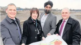  ??  ?? >
At the Phoenix 10 regenerati­on site in Darlaston (from left): David Warburton, head of public sector land for Homes England in the Midlands; Vivienne Clements, developmen­t director for Henry Boot Developmen­ts; Ninder Johal, board member of Black...