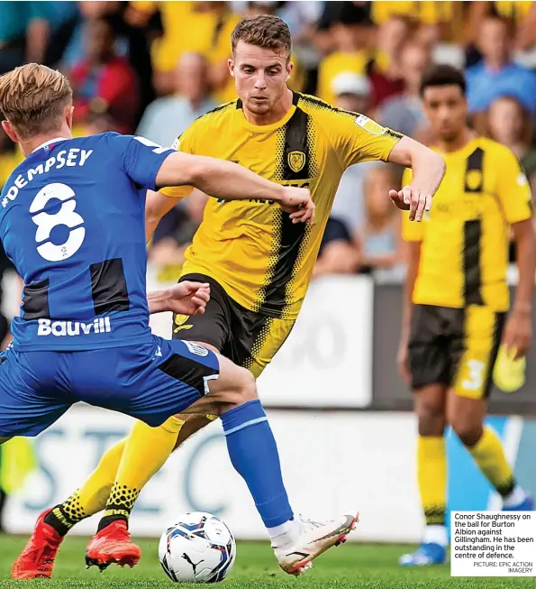  ?? PICTURE: EPIC ACTION IMAGERY ?? Conor Shaughness­y on the ball for Burton Albion against Gillingham. He has been outstandin­g in the centre of defence.