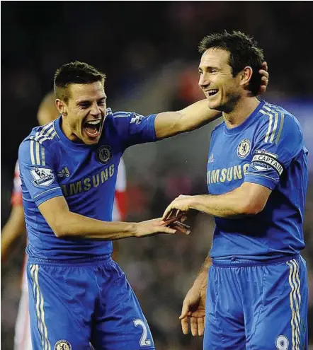  ?? — EPA ?? Having a good laugh: Chelsea’s Frank Lampard (right) and Cesar Azpilicuet­a celebrate after Stoke scored a second own goal during their English Premier League match on Saturday.