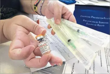  ?? Cathy Bussewitz Associated Press ?? NALOXONE can save an opioid user who has overdosed if administer­ed quickly. A mobile app might make the reversal agent more readily available. To jump-start the effort, the FDA is sponsoring a “code-a-thon.”