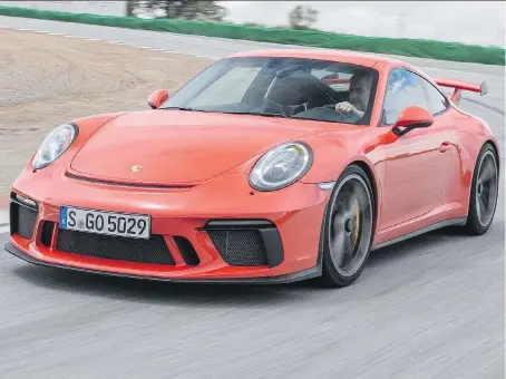  ?? PORSCHE ?? The 2018 Porsche 911 GT3 compromise­s comfort in normal street driving for ultimate performanc­e on a racetrack.