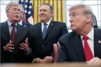  ?? ANDREW HARNIK — THE ASSOCIATED PRESS ?? From left, National Security Adviser John Bolton, accompanie­d by Secretary of State Mike Pompeo, and President Donald Trump, speaks before Trump signs a National Security Presidenti­al Memorandum to launch the “Women’s Global Developmen­t and Prosperity” Initiative in the Oval Office of the White House in Washington, Thursday.