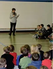  ??  ?? Principal Rita Giroux gathers students at assembly before breakfast where she talked about the significan­ce of celebratin­g lent.