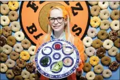  ?? ?? British artist Lucy Sparrow is pictured at her “Feltz Bagels” installati­on on Monday in New York.