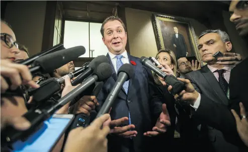  ?? ERNEST DOROSZUK / POSTMEDIA NEWS ?? Conservati­ve Party of Canada leader and Official Opposition leader Andrew Scheer talks to media after visiting Ontario Premier Doug Ford at the legislatur­e at Queen’s Park in Toronto on Tuesday.