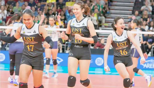  ?? PHOTOGRAPH BY JOEY SANCHEZ MENDOZA FOR THE DAILY TRIBUNE @tribunephl_joey ?? ANGELINE Poyos (No. 17), Regina Grace Jurado (No. 18) and Maria Cassandra Carballo celebrate a point during UST’s 25-19, 25-23, 25-22 win over National University Sunday in their UAAP Season 86 women’s volleyball match at the Mall of Asia Arena.