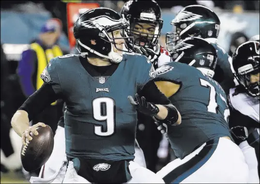  ?? Chris Szagola The Associated Press ?? Although Eagles quarterbac­k Nick Foles went 23 of 30 for 246 yards and no intercepti­ons in an NFC divisional playoff victory against the Falcons, his team is again a home underdog this week against the Vikings.