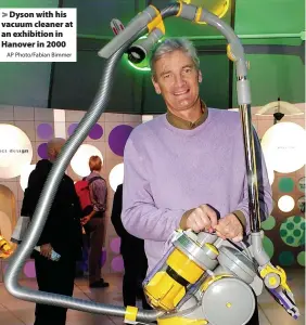  ?? AP Photo/Fabian Bimmer ?? Dyson with his vacuum cleaner at an exhibition in Hanover in 2000