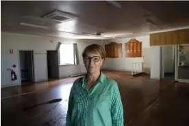  ?? Photograph: Mike Bowers/The Guardian ?? The clean up is underway at the bowling club in Molong. Treasurer Yvonne Clyde says everything has been ruined.