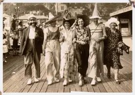  ??  ?? Bathing beauties, wonky donkeys and everyone in their best threads, parading on the promenade... there’s nothing quite like leafing through an album of holiday snaps. It knocks modern-day technology into a cocked (sun)hat