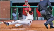  ?? STAFF PHOTO ?? Scott Moss scores for the Chattanoog­a Lookouts during a game against the Mississipp­i Braves at AT&T Field on April 19, 2019. The Lookouts did not play at all last year due to the COVID-19 pandemic, but they are set to open this year’s 120-game schedule on May 4 at AT&T Field.