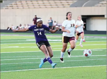  ?? Penny Chanler/Special to News-Times ?? Staying busy: El Dorado's London Ingram sends a shot to the goal against Lake Hamilton in action this season at Memorial Stadium. Ingram plays on Texarkana Soccer Club during the summer. The four-sport athlete is also practicing volleyball and competing with the Lady Wildcats' basketball team.