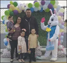  ?? PHOTO COURTESY OF CANDACE CRAVEN ?? The Sanchez family — (from left) Juan, Pearl, baby Noah, Eliana and Jacob — are greeted by the bunny at Palm Tree Elementary School.