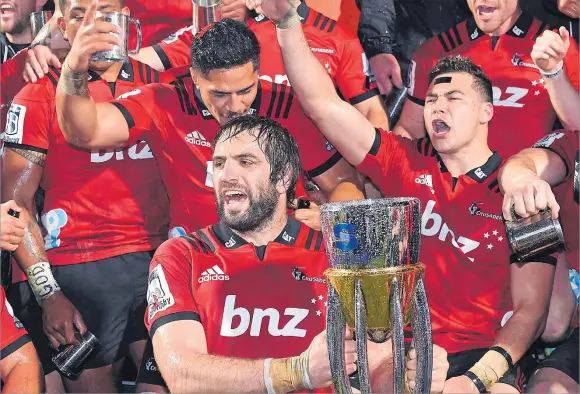 ?? Picture: REUTERS ?? Sam Whitelock of the Canterbury Crusaders holds the trophy as he celebrates with team mates after they defeated South Africa’s Lions during their Super Rugby final at AMI Stadium, Christchur­ch, New Zealand on August 4, 2018.
