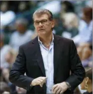  ?? SCOTT THRELKELD — THE ASSOCIATED PRESS FILE ?? In this file photo, Connecticu­t head coach Geno Auriemma watches the action in the second half of an NCAA basketball game against Tulane, in New Orleans. Auriemma says he has no interest in coaching the school’s men’s team. But the Hall-of-Famer, who...