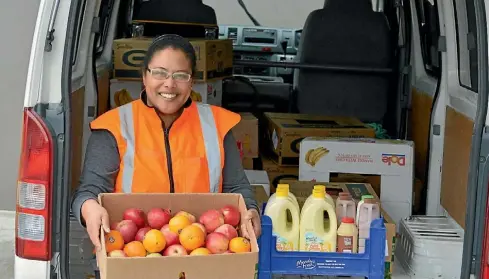  ??  ?? Tracy Wellington’s charity has just recieved 10 tonnes of tinned tomatoes