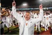  ?? Matthew Putney/Associated Press ?? Texas coach Steve Sarkisian celebrates the team’s win over Iowa State on Nov. 18 in Ames, Iowa. Texas is back — 14 years after last playing for a national championsh­ip, Texas (12-1) is in the College Football Playoff as Big 12 champion.