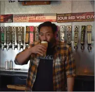  ?? ?? Calicraft brewmaster Thomas Vo does a little quality control at the Walnut Creek taproom that continues to evolve and expand.