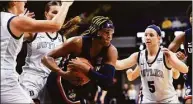  ?? Justin Casterline / Getty Images ?? UConn’s Aaliyah Edwards takes control of the ball during the first half against Butler.