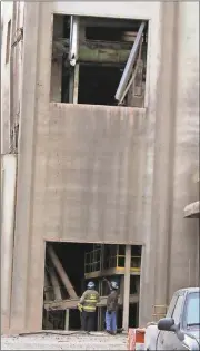  ?? Kevin Myrick / The Polk County Standard Journal ?? ATF officials inspect damage from an explosion at JCG Farms Feed Mill in Rockmart on Tuesday.