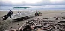  ??  ?? A tour operator drives his boat across the beach for a trip into the waters of Marino Ballena National Park on Costa Rica’s Pacific Coast.