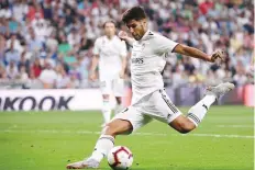  ?? Reuters ?? Real Madrid’s Marco Asensio scores their first goal at the La Liga match.