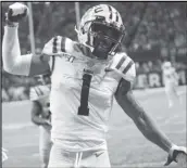  ?? Associated Press ?? HAPPY DANCE LSU wide receiver Ja’Marr Chase celebrates his touchdown against Georgia during the Southeaste­rn Conference championsh­ip on Dec. 7. Chase has been a reliable target for LSU quarterbac­k Joe Burrow this season.