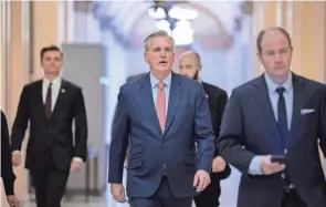  ?? J. SCOTT APPLEWHITE/AP ?? House Minority Leader Kevin Mccarthy, R-calif., who is hoping to become the next speaker of the House in the new Republican majority, leaves the chamber Friday after railing against the massive $1.7 trillion spending bill that finances federal agencies and provides aid to Ukraine, at the Capitol in Washington.