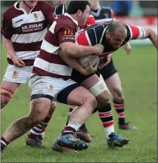  ??  ?? George Naoupu of Wicklow is tackled by Tullow’s Thomas Cashin.