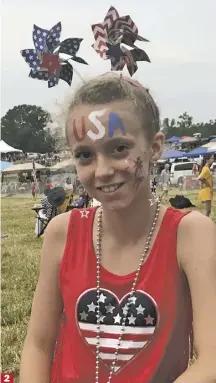  ??  ?? 2. Sperryvill­e’s Emily Johnson, meanwhile, proudly flashes the nation’s colors on her forehead;