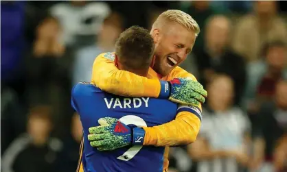  ??  ?? Kasper Schmeichel and Jamie Vardy embrace after combining to win the shootout for Leicester. Photograph: Ed Sykes/Action Images via Reuters