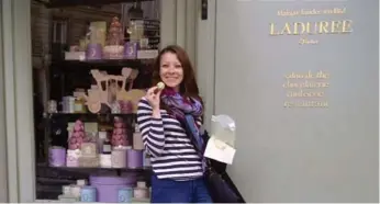  ?? CAITLIN BOROS PHOTOS ?? Caitlin Boros enjoying exquisite macarons at Laduree. She says Paris taught her patience and good taste.