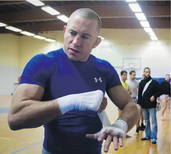  ?? — GETTY IMAGES FILES ?? Georges St-Pierre is back in the UFC, but will his first fight be the one many diehard MMA fans want to see?