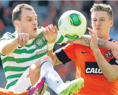  ??  ?? Barry Douglas goes up against former Celtic striker Anthony Stokes.