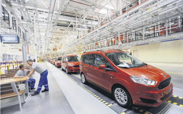  ??  ?? Ford Tourneo Courier light commercial vehicles are pictured at the Ford Otosan Yeniköy car plant in northweste­rn Kocaeli province, Turkey, May 22, 2014.