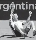  ?? Sergio Llamera AFP/Getty Images ?? MARCO CECCHINATO celebrates after winning the Argentina Open on Sunday.